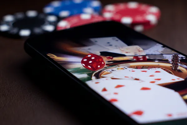 7555BET Live Casino — Join thrilling real-dealer tables A professional dealer in a tuxedo greeting players at the roulette table, symbolizing the authentic live casino feel at 7555BET.