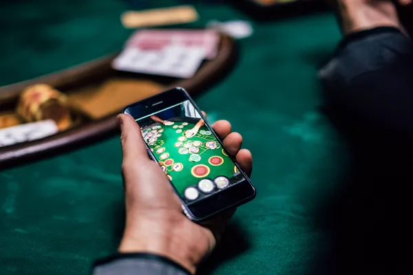 A glowing roulette wheel with cascading chips, symbolizing the engaging live and instant-win games available on 7555BET.